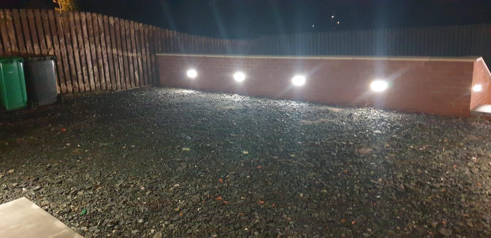 Garden walls with integrated lighting at night